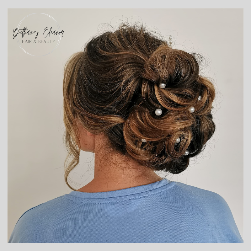 Image of bridal hair, large braided bun by Bethany Eleanor Hair & Beauty